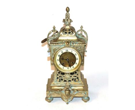 A gilt metal striking mantel clock 