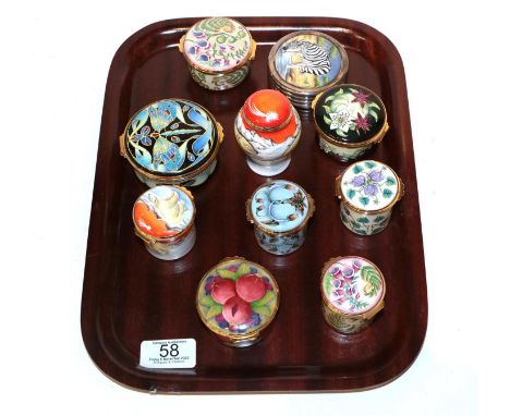 A collection of Moorcroft enamel boxes (10). All first quality. One of the box lids with one minor chip to edge, also a small