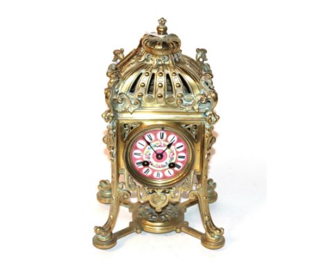 A gilt metal striking mantel clock, pink porcelain dial, movement stamped Hy Marc Paris