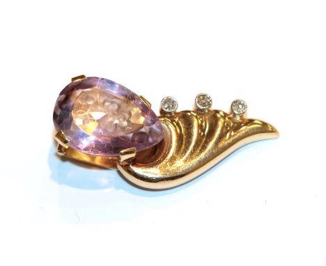 An amethyst intaglio and diamond clip, length 3.5cm .  Unmarked, gross weight 7.6 grams.