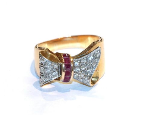 A ruby and diamond bow motif ring, unmarked, finger size P1/2.  Gross weight 7.9 grams. 