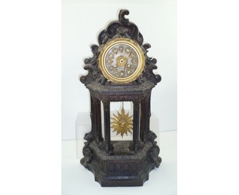 BRIGHT, PARIS A LATE 19TH CENTURY FRENCH CARVED AND BLACK FINISHED MANTEL CLOCK, having ornate floral and four column case, 8