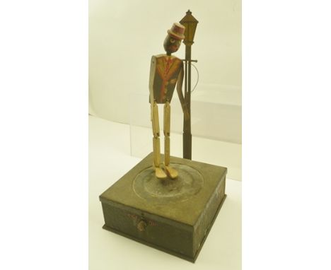 A "NATIONAL MICROPHONE DANCER" referred to as "Microphone Sam", circa 1935, wire fixing to street lamp (see printed text to b