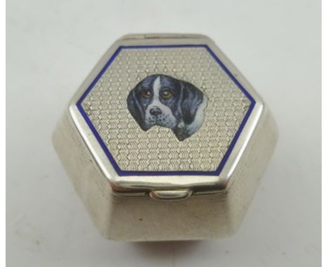 AN EARLY 20TH CENTURY EGYPTIAN SILVER AND ENAMEL PILL BOX, hexagonal form, the hinged cover with enamel hounds head decoratio