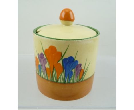 A CLARICE CLIFF BIZARRE CYLINDRICAL PRESERVE JAR WITH COVER, hand-painted in the Rhodanthe pattern 