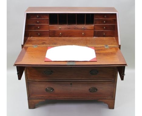 A GEORGE III MAHOGANY FALL FRONT BUREAU, fitted interior, brass handles, fitted three drawers on bracket feet, 99cm wide x 10