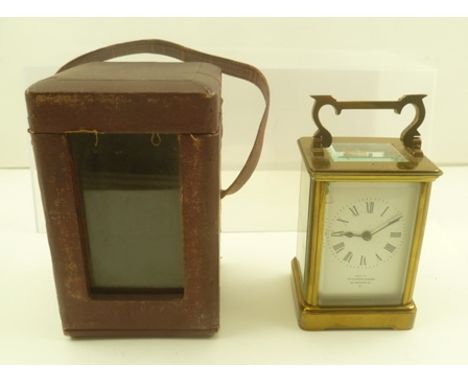 A LATE 19TH CENTURY BRASS FRAMED CARRIAGE CLOCK having white enamel dial with Roman numerals, inscribed "Examined by Edwards 