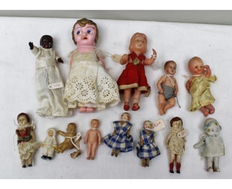 A COLLECTION OF 13 VARIOUS SMALL DOLLS in bisque, wood, celluloid and ceramic. 