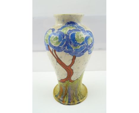 A CLARICE CLIFF "PATINA BLUE FIRS" BIZARRE CERAMIC VASE of baluster form, hand-painted tree in landscape on a splatter ground