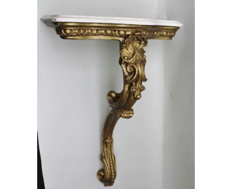 A 19TH CENTURY WALL BRACKET TABLE, of monopod Rococo form, supporting a serpentine fronted white marble top 