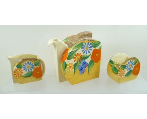 A CLARICE CLIFF BIZARRE THREE-PIECE BACHELOR TEA SET, hand painted in "Canterbury Bells" pattern, Stamford shape teapot, milk