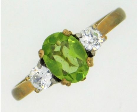 A 9ct gold ring set with peridot &amp; white paste stones, 2.5g, size Q