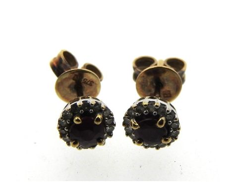 A pair of 9ct gold earrings set with ruby & fourteen small diamonds, 5.5mm diameter, 1.3g 