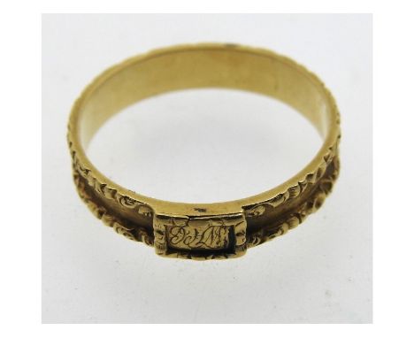 A yellow metal ring with mounted engraved plaque, tests electronically as 18ct gold, 2g, size N/O