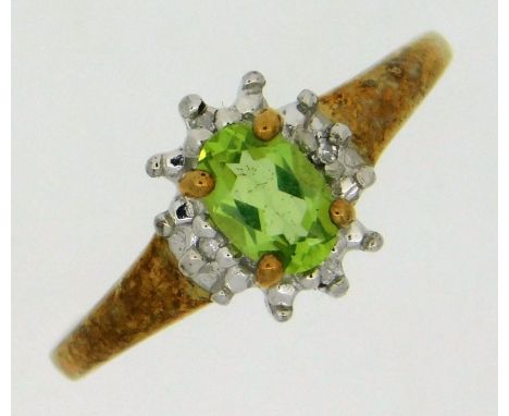 A 9ct gold ring set with peridot &amp; small diamonds, 2.4g, size M