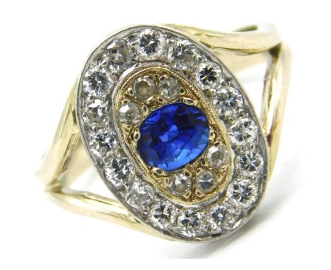 A two colour gold diamond &amp; sapphire ring set with approx. 0.7ct of diamond &amp; a 5mm x 4mm sapphire, size M/N, 3.9g