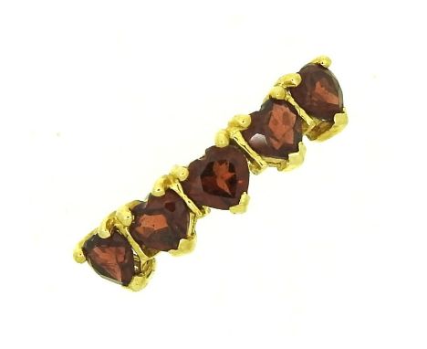 A 9ct gold half eternity ring set with heart shaped garnets, 1.7g, size N/O 