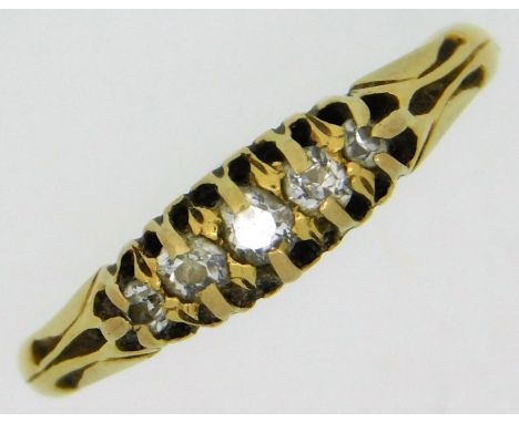 An antique 18ct gold ring set with five small diamonds, size M/N, 2.3g