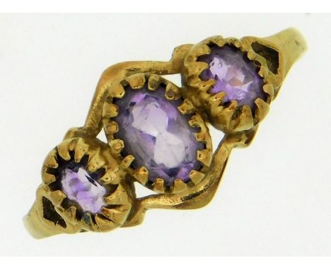 A 9ct gold ring set with three amethyst stones, 1.5g, size M