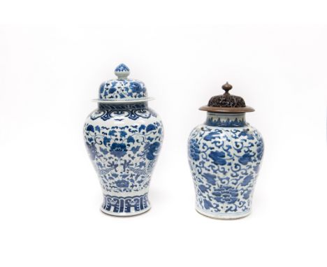 (2) Chinese porcelain Blue & White baluster vases. One from the Transitional period and potted to support four lug handles at