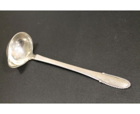 A VINTAGE GEORGE JENSEN STERLING SILVER LADLE