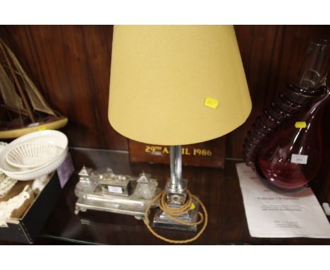 A SILVER PLATED TWIN INKWELL DESK STAND TOGETHER WITH A SILVER PLATED CORINTHIAN COLUMN TABLE LAMP (2)
