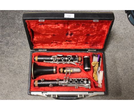 A CASED BUFFET CHAMPION &amp; CIE A PARIS CLARINET