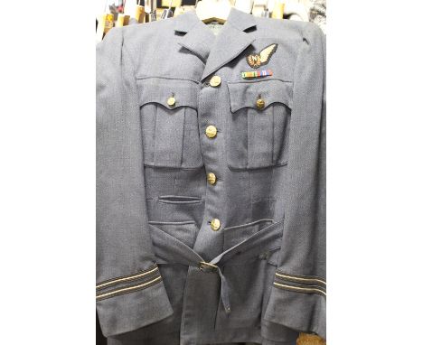 A VINTAGE R.A.F. UNIFORM - TAILORED IN CANADA WITH UNUSUAL BRASS 'CANADIAN GOOSE AND KINGS CROWN' BRASS BUTTONS, TOGETHER WIT