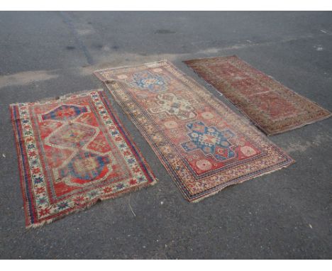 THREE VINTAGE EASTERN WOOLLEN RUGS