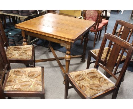 A VINTAGE OAK DRAWLEAF DINING TABLE WITH A SET OF FOUR SIMILAR OAK DINING CHAIRS