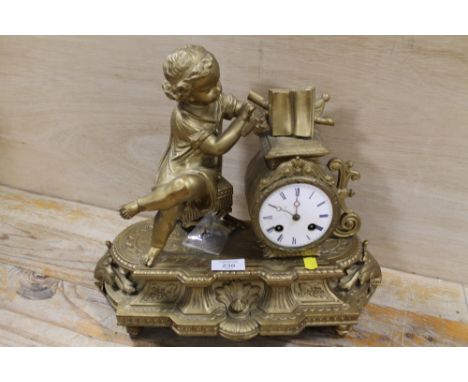 A GILT METAL MANTLE CLOCK WITH FIGURE OF GIRL READING A BOOK A/F