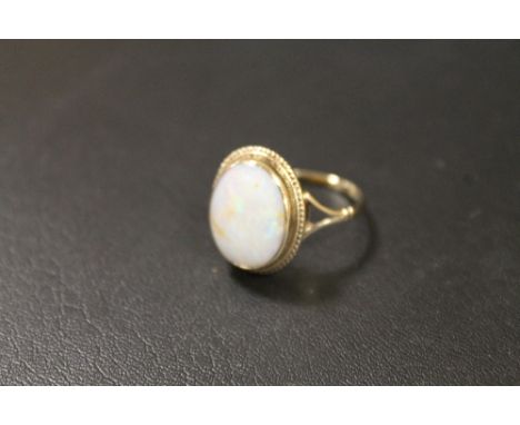 A HALLMARKED GOLD OPAL RING