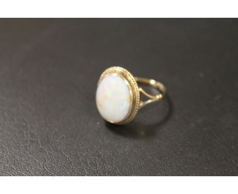 A HALLMARKED GOLD OPAL RING