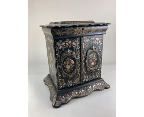 A Victorian black lacquered papier-mache sewing, jewellery and writing cabinet, inlaid with abalone shell floral designs and 