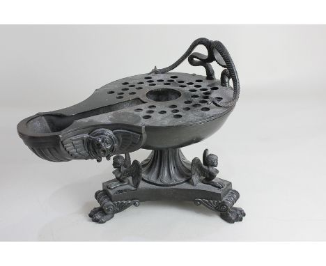 A Neoclassical bronze 'Aladdin' lamp, the triform platform base decorated with sphinx, on paw feet, 26.5cm