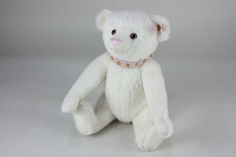 A Steiff Collectors Bear, No. 662683, limited edition 2008, in white mohair with ear stud, wearing a pink studded collar, 27c
