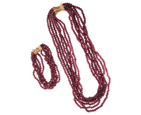 A "RUBY" MULTI-STRAND BEADED NECKLACE AND BRACELET both with 14K yellow gold clasps (2)