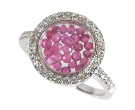 A DIAMOND AND RUBY BEAD RING the central ruby beads surrounded by a circular border of diamonds, on a 9ct white gold shank, w