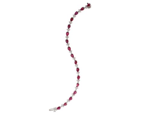 A RUBY AND DIAMOND LINE BRACELET the concealed clasp stamped "14K", (c.9.8grams total weight)