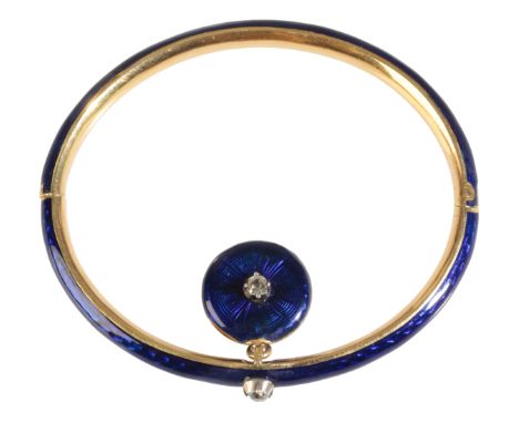 A BLUE ENAMEL, GOLD AND DIAMOND BANGLE the blue enamelled bangle set with a solitaire diamond, suspending a diamond set ename