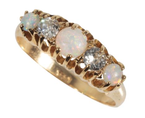 AN OPAL AND DIAMOND DRESS RING the three white tone opals interspersed by two brilliant-cut diamonds, on an 18ct yellow gold 