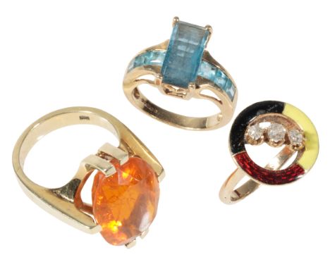 THREE 9CT GOLD DRESS RINGS including a three stone diamond and enamel ring, and a blue topaz ring (3)