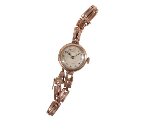 A LADY'S 9CT GOLD BRACELET WATCH with manual wind movement, the silver dial with black Arabic numerals and dark blue steel ha