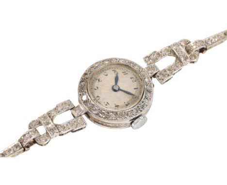 A LADY'S PLATINUM AND DIAMOND COCKTAIL WATCH with manual wind movement, the silver dial with black Arabic numerals and dark b