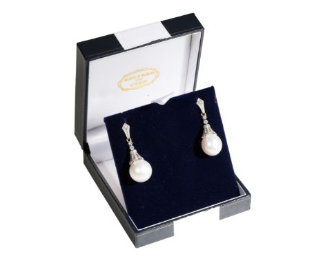 BRUFORD AND CARR: A PAIR OF DIAMOND AND CULTURED PEARL DROP EARRINGS each white-tone cultured pearl attached to a diamond-enc