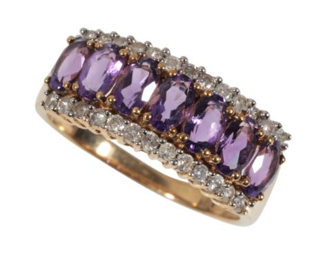 AN AMETHYST AND DIAMOND DRESS RING the central row of amethysts set within two outer borders of diamonds. on a 9ct yellow gol