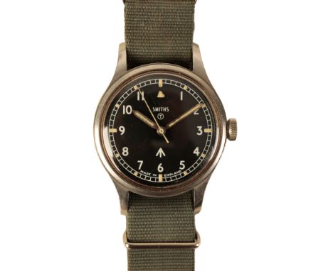 SMITHS: A GENTLEMAN'S MILITARY ISSUE STAINLESS STEEL WRISTWATCH with manual wind movement, the black dial with Arabic numeral