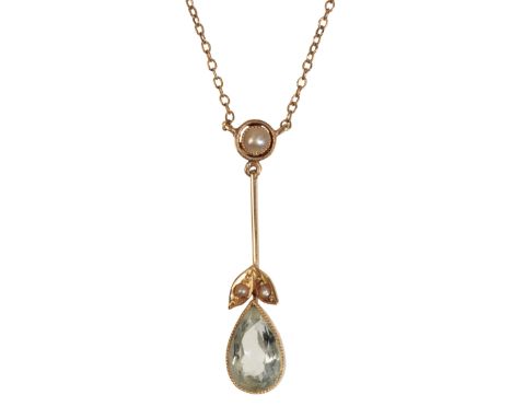 AN AQUAMARINE &amp; SEED PEARL PENDANT NECKLACE attached to an unmarked yellow metal chain, 36cms long