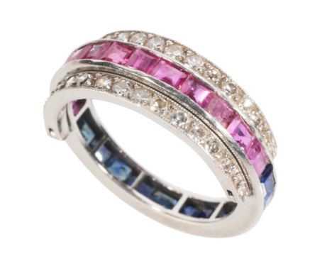 A DIAMOND, RUBY AND SAPPHIRE SWIVEL ETERNITY RING set with calibre-cut rubies, sapphires and round-cut diamonds, ring size N