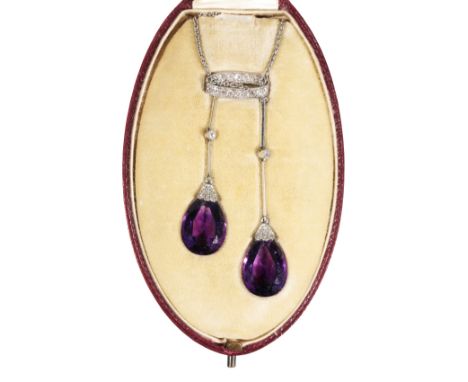 A BELLE EPOQUE AMETHYST AND DIAMOND NECKLACE the two amethyst drops with diamond-set mounts and a single diamond bar, held wi